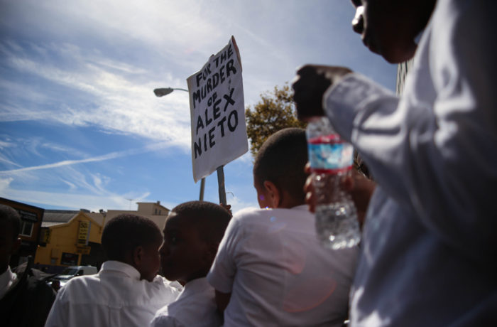 Children from the Nation of Islam stand outside on the steps of the Hall of Justice during a press conference with mothers and families of loved ones killed by law enforcement demanding that District Attorney George Gascón file charges against police officers involved in fatal police shootings that have occurred in San Francisco, California on October 7, 2016. Photo:  Joel Angel Juárez