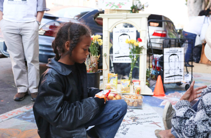 Ishy-Me in front of the memorial for Luis Demetrio Góngora Pat on Shotwell Street near 19th Street on Oct. 7. Photo Jessica Webb