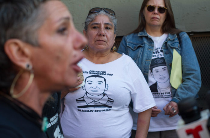 Laura Guzman, from the Mission Neighborhood Resource Center, addresses the media on Oct. 7 at a press conference, held 6 months after the shooting death of Luis Gongora Pat by the SFPD. Photo: Patricio Guillamon